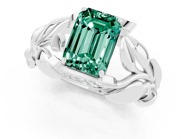 Silver Emerald Cut Green Sapphire Leaf-Inspired Engagement Ring with Round Accents and Prong Setting