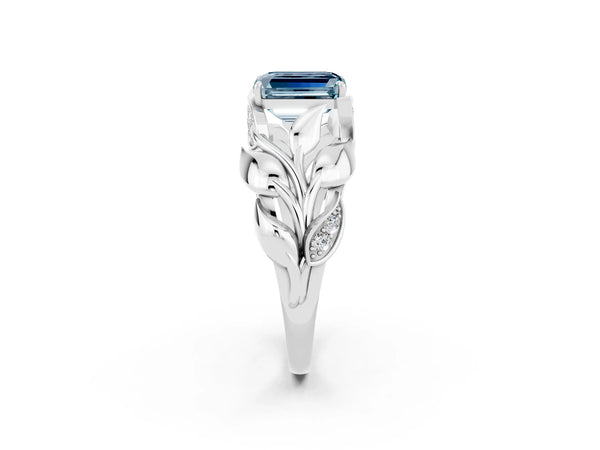 Platinum Emerald Cut Aquamarine Leaf-Inspired Engagement Ring with Round Accents and Prong Setting