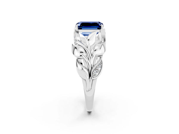 Platinum Emerald Cut Blue Sapphire Leaf-Inspired Engagement Ring with Round Accents and Prong Setting