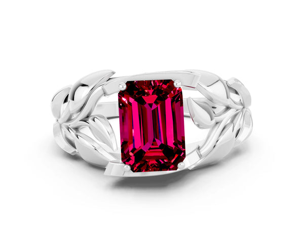Platinum Emerald Cut Garnet Leaf-Inspired Engagement Ring with Round Accents and Prong Setting