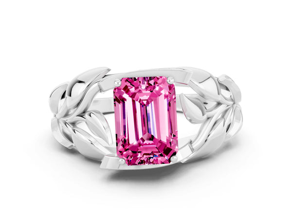 Platinum Emerald Cut Pink Sapphire Leaf-Inspired Engagement Ring with Round Accents and Prong Setting
