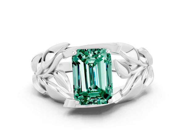 Silver Emerald Cut Green Sapphire Leaf-Inspired Engagement Ring with Round Accents and Prong Setting