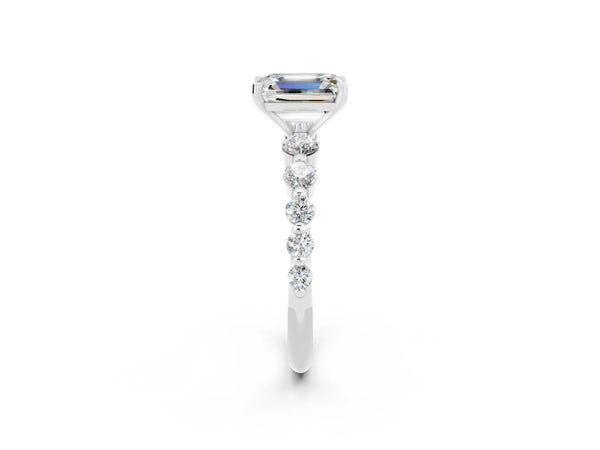 Platinum Emerald Cut Solitaire Moissanite Ring with Pave Band and Four-Prong Setting
