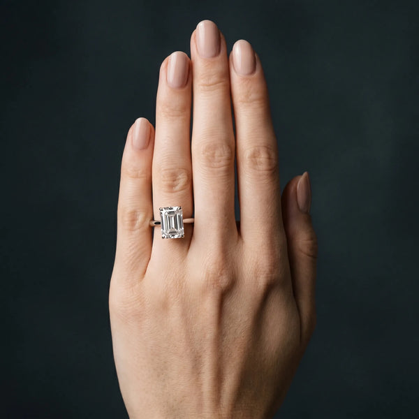 White gold Emerald Cut Solitaire Ring with Cathedral Band and Four-Prong Setting