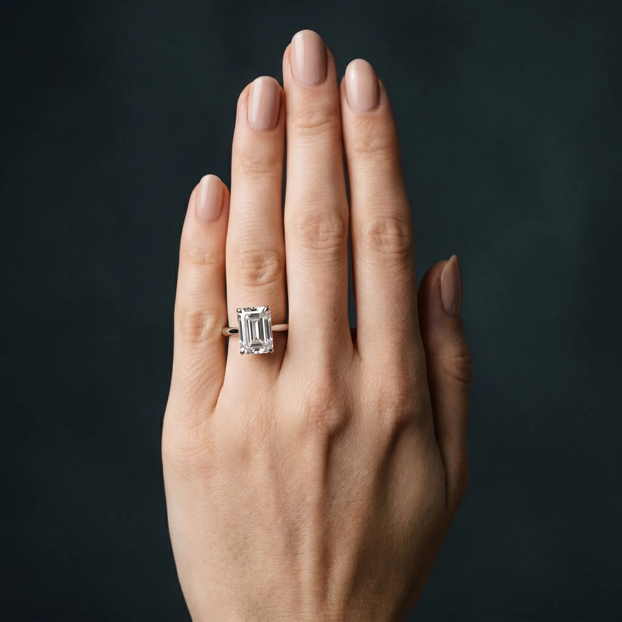 White gold Emerald Cut Solitaire Ring with Cathedral Band and Four-Prong Setting