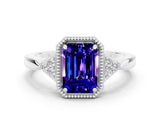White gold Emerald Cut Tanzanite Halo Ring with Tapered Band and Four-Prong Setting