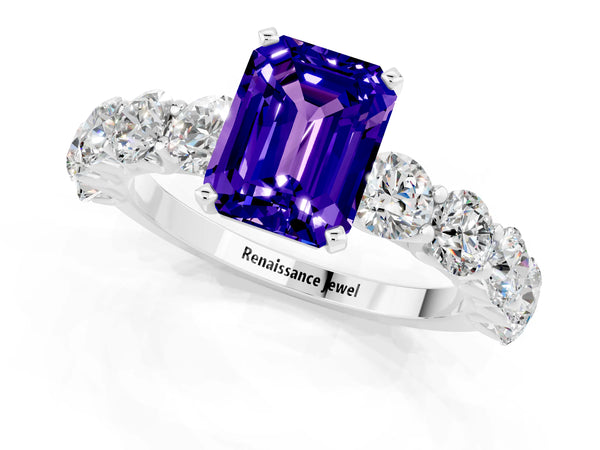 White gold Emerald Cut Tanzanite Prong Setting with Side Stones on a Pave Band