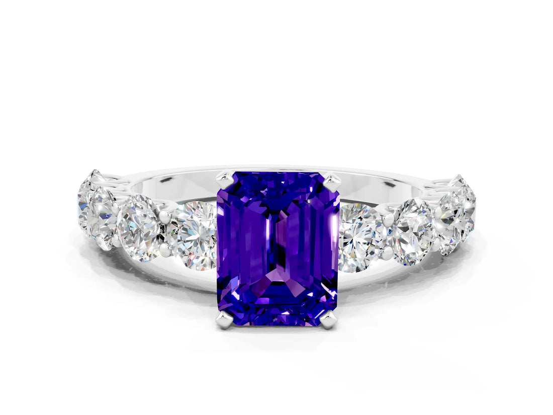 White gold Emerald Cut Tanzanite Prong Setting with Side Stones on a Pave Band