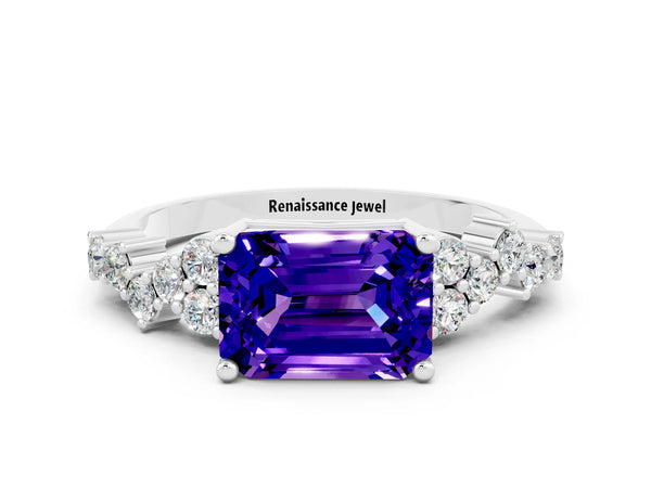 Platinum Emerald Cut Tanzanite Scattered Round Accent Ring with Prong Setting