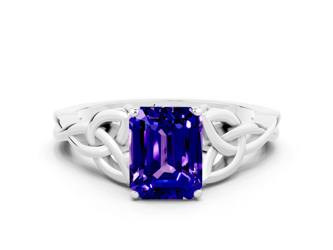 White gold Emerald Cut Tanzanite Solitaire Engagement Ring with Celtic Knot Band and Four-Prong Setting