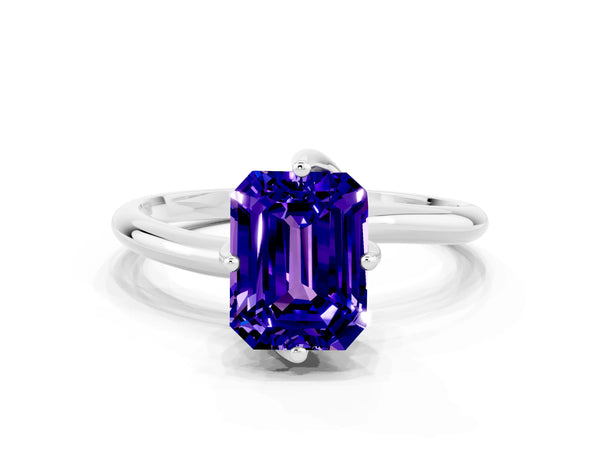 Platinum Emerald Cut Tanzanite Solitaire Engagement Ring with Four-Prong Setting and Classic Band
