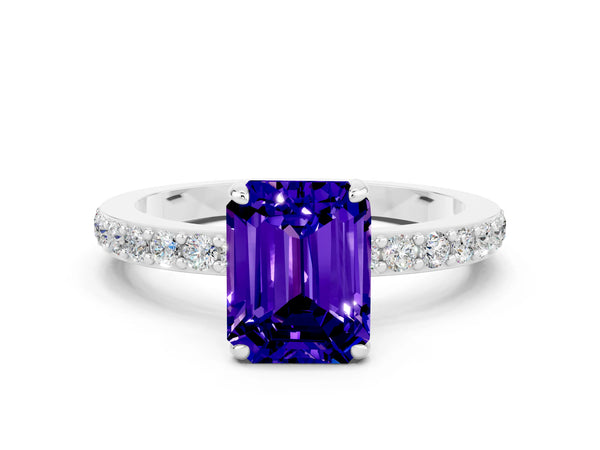 Platinum Emerald Cut Tanzanite Solitaire Engagement Ring with Pavé Band and Four-Prong Setting