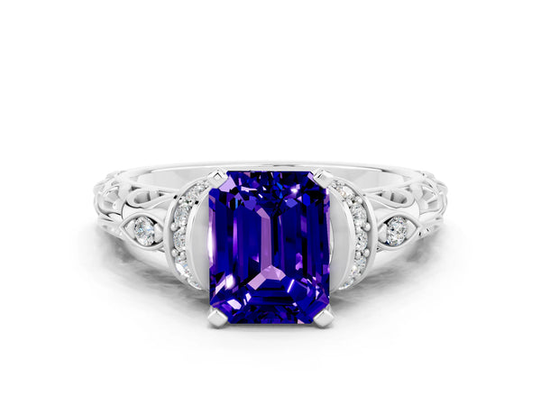 White gold Emerald Cut Tanzanite Solitaire Ring with Filigree Band and Four-Prong Setting