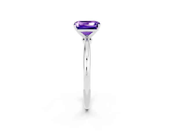 Platinum Emerald Cut Tanzanite Solitaire Ring with Six-Prong Setting and Classic Band