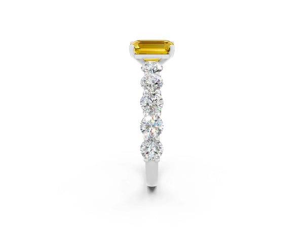 Platinum Emerald Cut Yellow Sapphire Prong Setting with Side Stones on a Pave Band