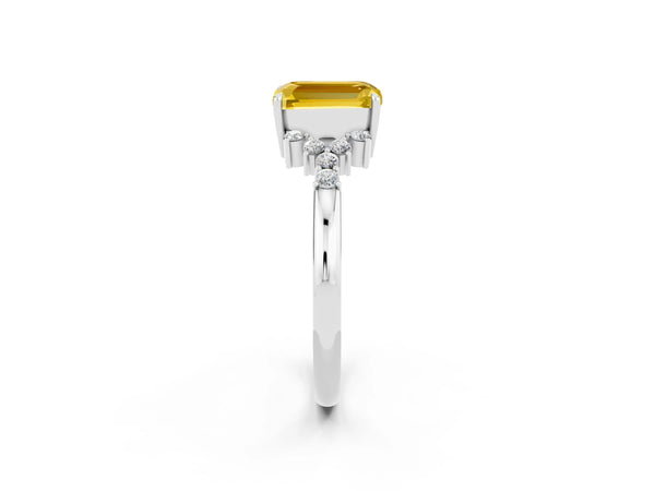 Platinum Emerald Cut Yellow Sapphire Ring with Side Stones and Four-Prong Setting