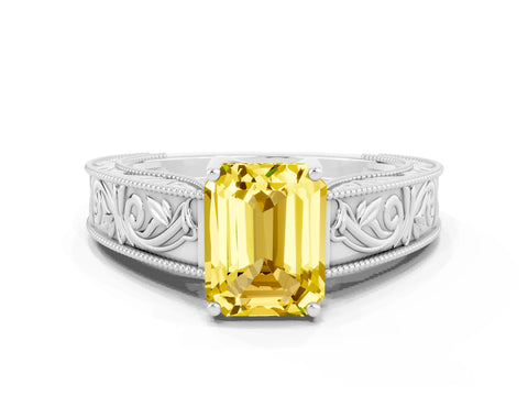 White gold Emerald Cut Yellow Sapphire Solitaire Ring with Engraved Band and Four-Prong Setting