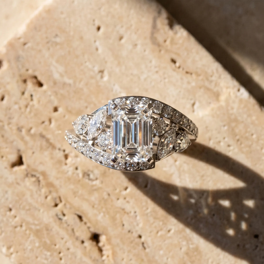 White gold Emerald Diamond Halo Ring with Marquise and Pavé Band in Prong Setting