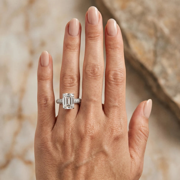 White gold Emerald Diamond Solitaire Ring with Prong Setting and Pavé Band