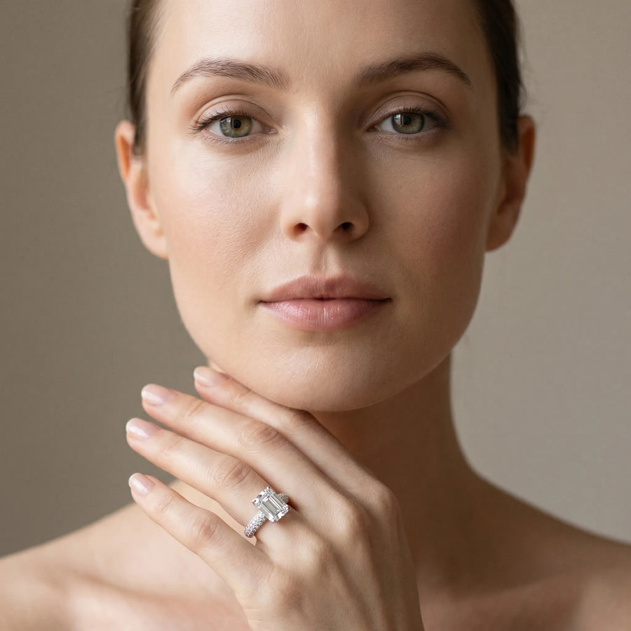 White gold Emerald Diamond Solitaire Ring with Prong Setting and Pavé Band
