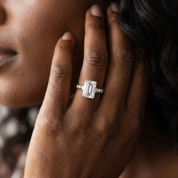 White gold Emerald Solitaire Beaded Band with Four-Prong Setting