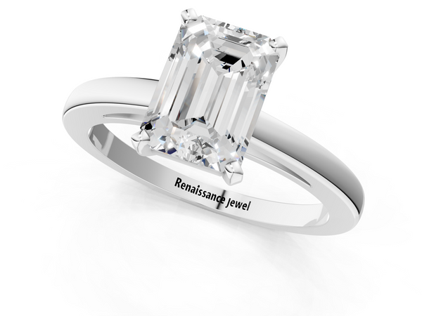 White gold Emerald Solitaire Diamond Engagement Ring with Four-Prong Setting on a Classic Band