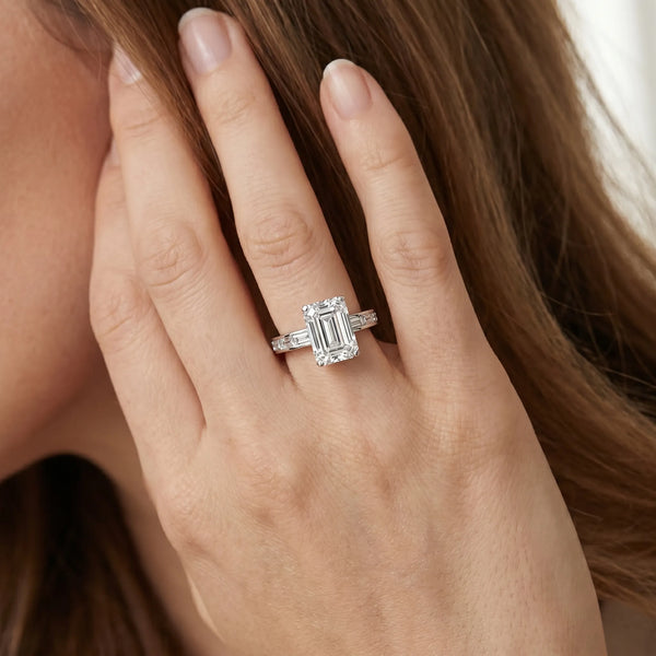 White gold Emerald Solitaire Diamond Ring with Channel-Set Baguette Band and Four-Prong Setting