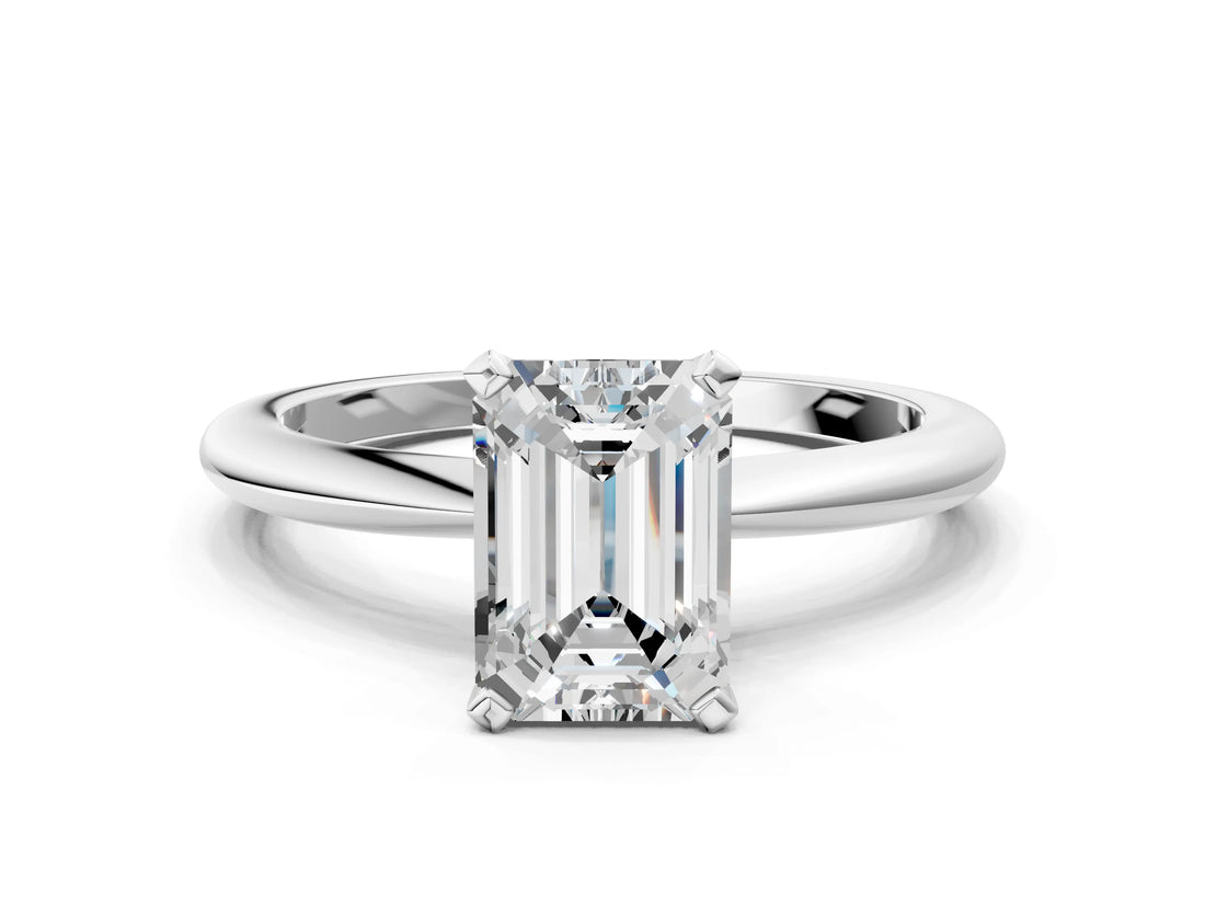 White gold Emerald Solitaire Diamond Ring with Six-Prong Setting on a Classic Band