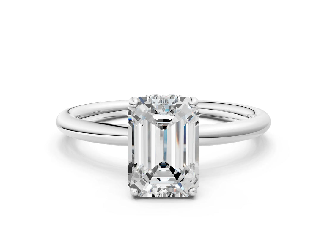 White gold Emerald Solitaire Diamond Ring with a Classic Band and Four-Prong Setting