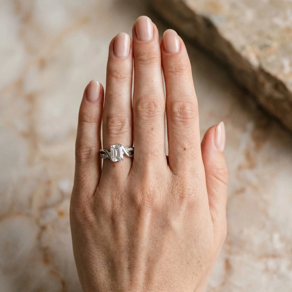 White gold Emerald Solitaire Twisted Band with Prong Setting