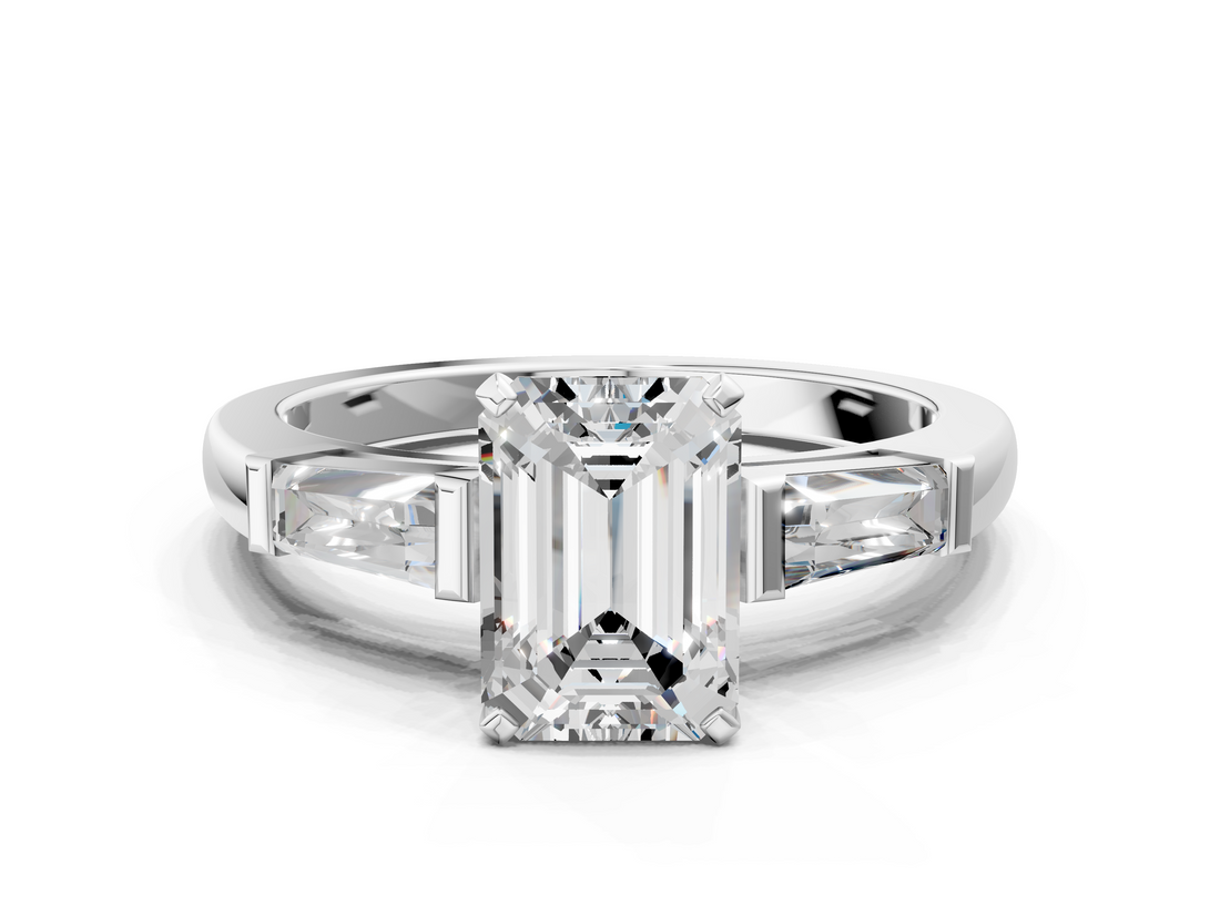 White gold Emerald Solitaire with Tapered Baguette Side Stones on a Classic Band with Four-Prong Setting_221