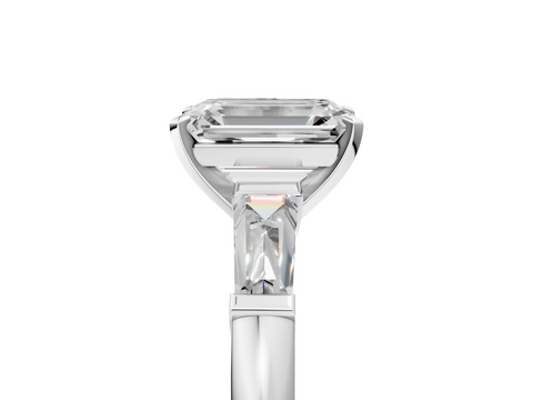 White gold Emerald Solitaire with Tapered Baguette Side Stones on a Classic Band with Four-Prong Setting_226