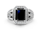 White gold Fancy Black Emerald Cut Diamond Halo Ring with Split Shank and Bezel Accents and Four-Prong Setting