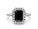 White gold Fancy Black Emerald Cut Halo Round Diamond Solitaire Ring with Pavé Band and Four-Prong Setting