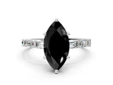 White gold Fancy Black Marquise Cut Diamond Solitaire with Side Baguettes and Channel Set Band