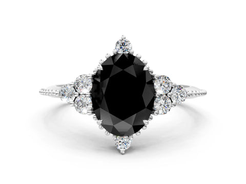 White gold Fancy Black Oval Cut Brilliant Diamond with Cluster Setting on a Beaded Band and Four-Prong Setting