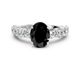 White gold Fancy Black Oval Cut Diamond Prong Setting with Side Stones on a Pave Band
