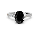 White gold Fancy Black Oval Cut Diamond Solitaire with Side Baguettes and Channel Set Band