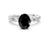 White gold Fancy Black Oval Cut Solitaire Twisted Band with Pavé Accents and Four-Prong Setting