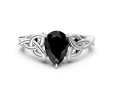 White gold Fancy Black Pear Cut Diamond Solitaire Engagement Ring with Celtic Knot Band and Four-Prong Setting