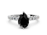 White gold Fancy Black Pear Cut Diamond Solitaire Pavé Band with Four-Prong Setting