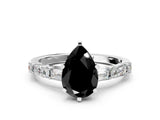 White gold Fancy Black Pear Cut Diamond Solitaire with Side Baguettes and Channel Set Band