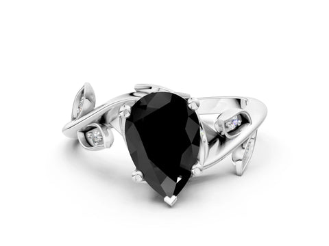 White gold Fancy Black Pear Cut Solitaire Twist Engagement Ring with Leaf Accents and Prong Setting