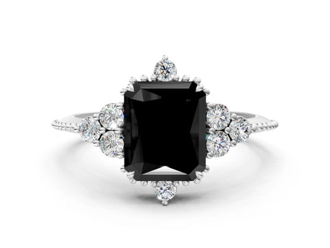 White gold Fancy Black Radiant Cut Brilliant Diamond with Cluster Setting on a Beaded Band and Four-Prong Setting