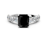 White gold Fancy Black Radiant Cut Diamond Prong Setting with Side Stones on a Pave Band