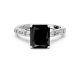 White gold Fancy Black Radiant Cut Diamond Solitaire with Side Baguettes and Channel Set Band