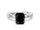 White gold Fancy Black Radiant Cut Solitaire Twisted Band with Pavé Accents and Four-Prong Setting