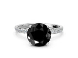 White gold Fancy Black Round Cut Diamond Solitaire Engagement Ring with Pavé Band and Prong Setting