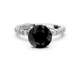 White gold Fancy Black Round Cut Diamond Solitaire Ring with Pavé Accents and Four-Prong Setting