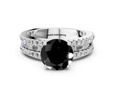 White gold Fancy Black Round Cut Diamond Solitaire Ring with Pavé and Channel Set Band